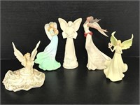 Five assorted poly stone angel figures
