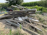 Pile of posts and wood.    Bring trailer,