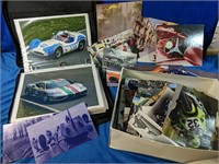 Binder of racecars and box of pictures
