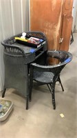 Black wicker chair and desk with kitchen items