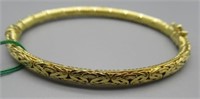 14K Gold Woven Style Bangle. Size 7" Long.