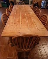 rustic wooden table with 10 dining chairs