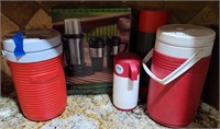 selection of thermos and small coolers