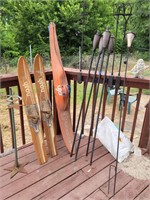tiki torches, skis and plant stand