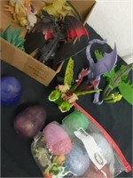 Large group of kids toys, including hatch eggs,