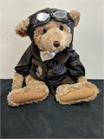 14" sitting. Cute pilot plush bear.