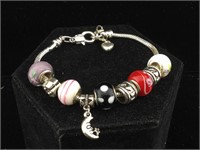 Bracelet with some sterling charms 3.5 inches