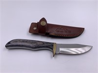 Skinning knife with brass slotted guard wood scale