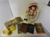 PORCELAIN DOLL, CHAIR, BOOKS ,ALL ITEMS SOLD AS