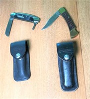 Two Buck Folding Knives in Leather Cases