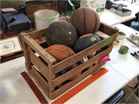 Wood crate full of balls