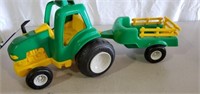 Green and yellow tractor and wagon