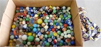 Marbles, regular and shooters and marble bag