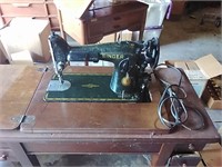 vintage Singer sewing machine and stand.  Very