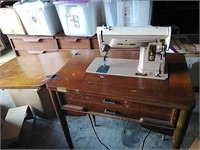 Vintage singer sewing machine in table