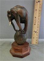DG71- elephant horn carving on mah. stand having