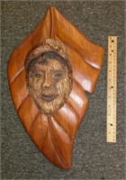 DG86- carved wood mask on leaf signed Eileen