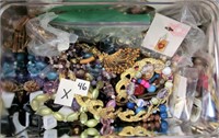 X-46 lot of costume jewelry in a tin