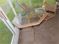 TABLE WITH FOUR CHAIRS; SEATS ARE PADDED AND
