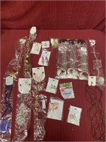 15 pieces of costume jewelry and bag of 12