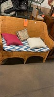 Wicker love seat with cushion
