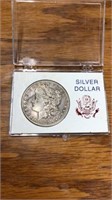 1899 O Morgan silver dollar coin in case