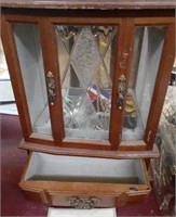 Wood and glass jewelry case with jewelry inside