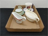 2 gravy boats, 2 mugs with saucers, glass ball