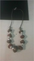 Large copper metal bead and silver tone necklace