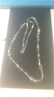 Long necklace with gold tone Accents in