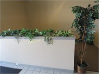 artificial plant and plants in planter