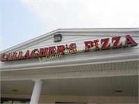 Gallaghers Pizza lighted letters outside building