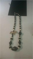 Black and white bead necklace with a zebra figure