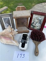 Conch shell, picture frames, bird feeder, brush