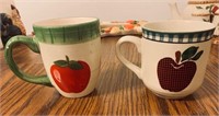 Two apple themed mugs
