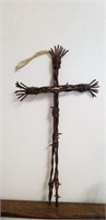 Cross made out of barb wire, made to hang on wall