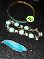 Blue colored pen, bracelet and bangle