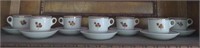 Shelf of Royal Ironstone China tea cups & Saucers