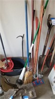 Lot of brooms and mops