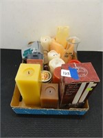 assorted candles and candle holders