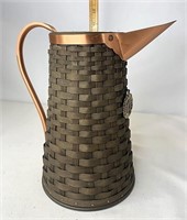 Hand woven pitcher with copper and tie on