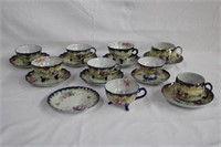 Assortment of floral cups and saucers
