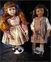 2 collectible dolls with stands, tallest doll
