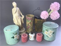 Assorted tins, candles and statue