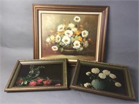 Group of three framed floral pictures