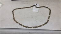28 inch gold colored men’s chain. Clasp says 14 k