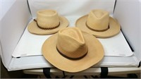 Three men’s straw hats with leather bands