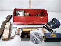 Toolbox in assortment of tools including saw