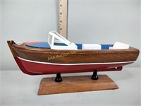 Wood boat and a tripod
