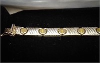 Sterling silver tennis bracelet with gold colored